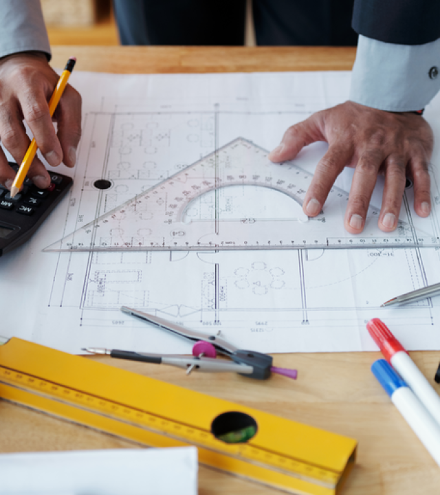 hands-unrecognizable-male-architect-working-technical-drawing-using-calculator